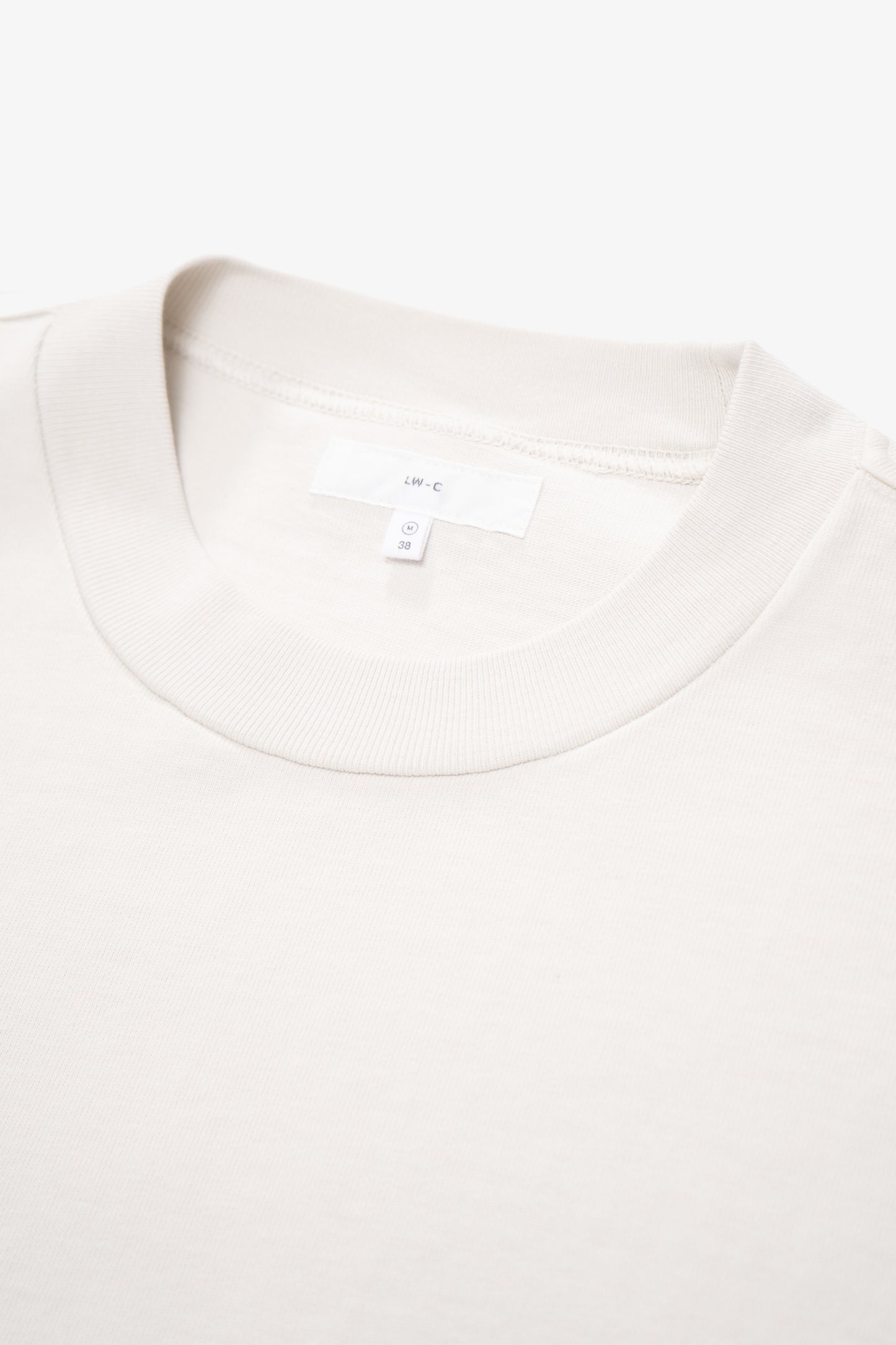 Close-up of collar of LW130T Rugby T-shirt in off white